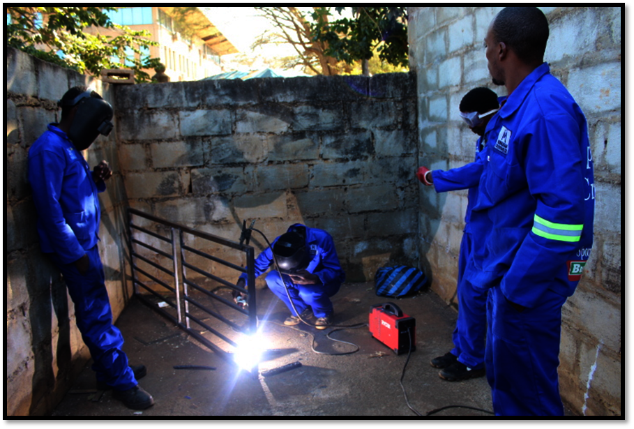 Image1: welding trainees producing a burglar door