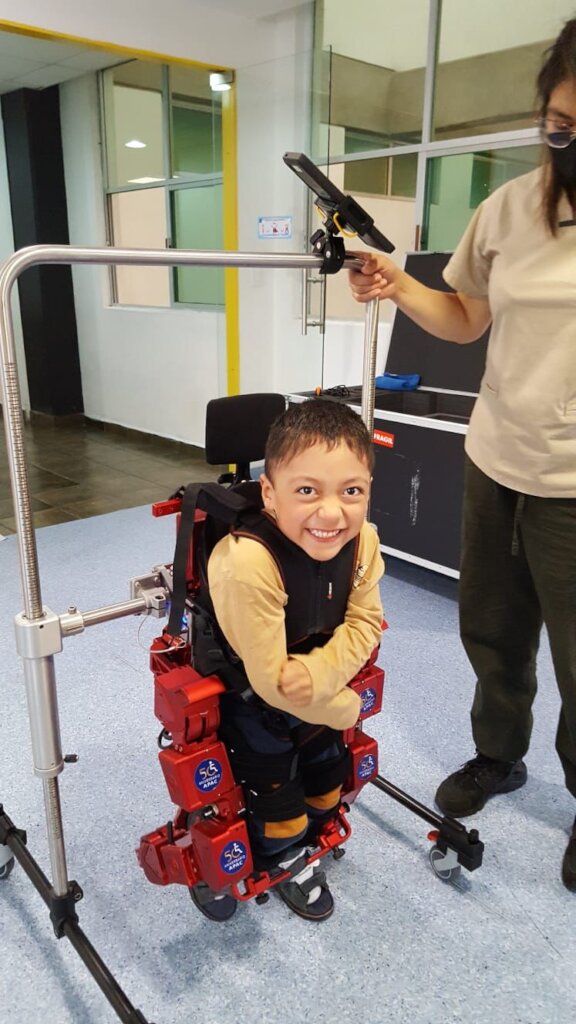 Walk assisted by Pediatric exo-skeleton