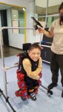 Walk assisted by Pediatric exo-skeleton