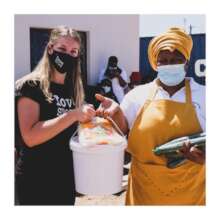 Love Story staff member handing over a bucket