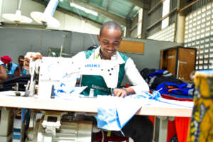 A dressmaker trainee working on a sewing machine