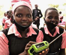 Meru girls receiving Fenix radios
