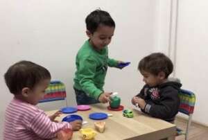 Dima playing with his brother and sister