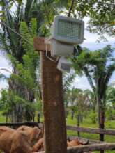 A motion-sensor solar light installed by a corral.