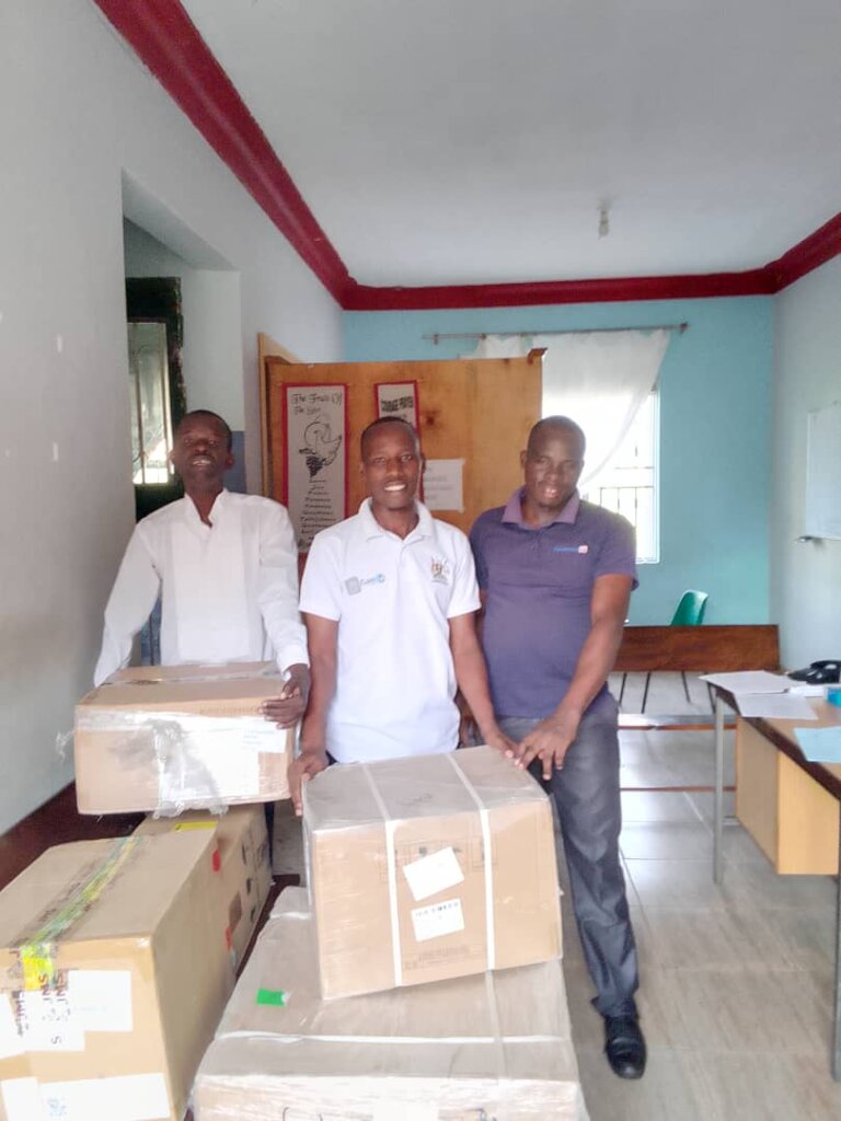Staff at Unyama receiving an Ultrasound machine