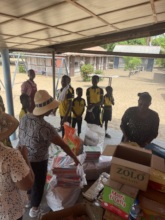 Volunteers handing out books