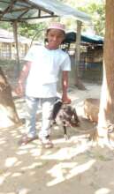 A student with his rared Goat