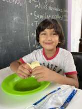 Thiago enjoying fresh fruit.