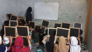 Students eagerly showcase their work! Kabul