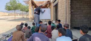 Learning Together: Boys Attending Outdoor Class