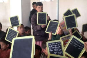 Kids loving the mini chalkboards provided by GEC