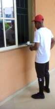 Our Project Leader bringing out money to pay