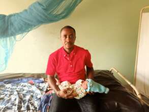 Our Project Leader carrying the baby