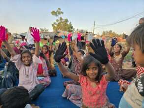 Children showing off their winter mittens