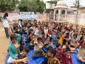 Children at the Varsha clinic site listening well.