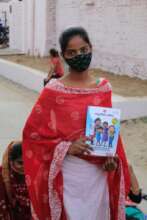 Young woman with menstruation clinic materials..
