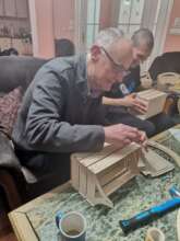 Richard helping assemble the baskets in Serbia