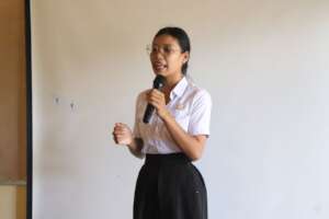 Student participating in Public Speaking activity