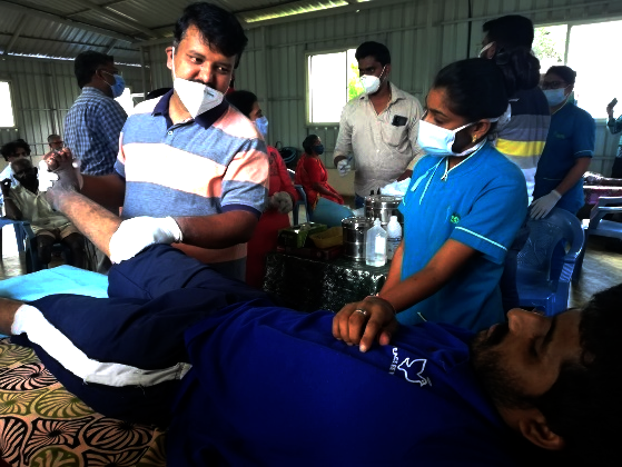 Person affected by leprosy receiving physiotherapy