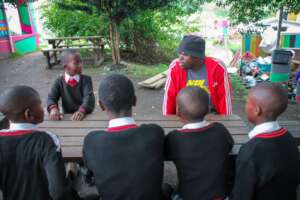 Thabiso chatting with a group of boys