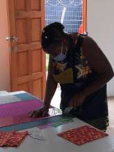 Temie hard at working cutting fabric