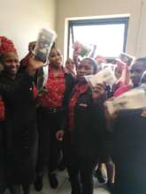 Ladies at our local supermarket receiving Kits