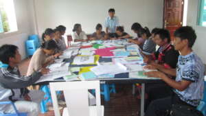 Students practicing skills in workbooks