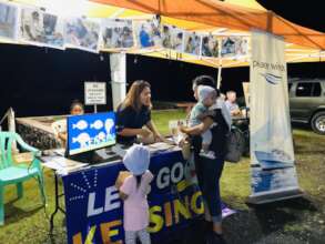 PW Palau educational booth at a night market