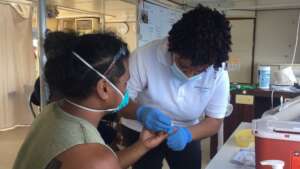 Palauan receiving health screening