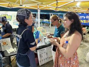 Peace Winds staff and visitors at night market