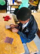 Girls learning how to sew a reusable feminine