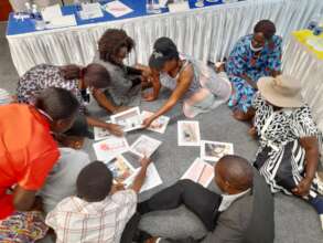 Parents work on a puzzle on "reporting abuse"