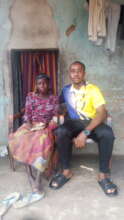 Our Project Leader supporting an elderly woman