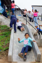 Children play on the new slide, Chamos, 2023.