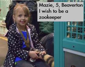 Mazie holding a tiger's tail