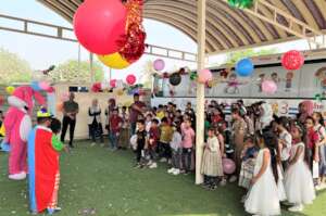 A clown and rabbit join kids at Hope Bus 3 party