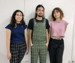 Higor and fellow students modelling their clothes