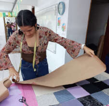 Adriella making patchwork from offcuts