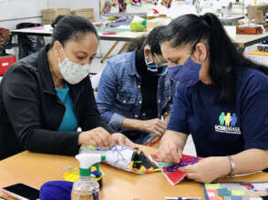 Fatima teaches an embroidery class