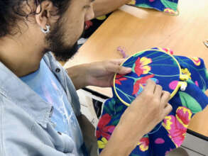 Higor learns how to embroider 'chita'
