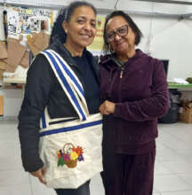 Ivonete and teacher Ede with a new style of bag