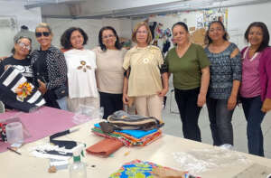 Dona Ede shows products to a visitor