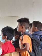 children pay attention to the projected video