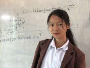 Sophae poses in her classroom