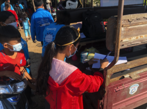 Bopha registering children for the Mobile Library
