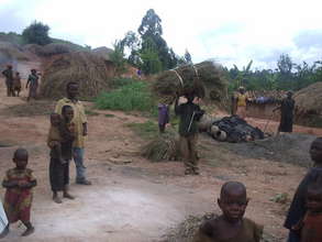Children and Parents Heating Pots at Home