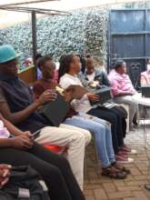 Image 1&2: Cohort 12 trainees looking at products