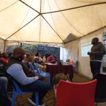 Image 9: Facilitator Patrick in session at the men