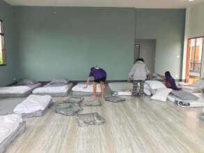 Getting the beds ready for the group.