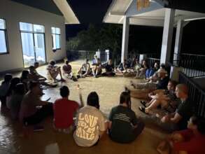 The team at their evening de-brief on the deck.